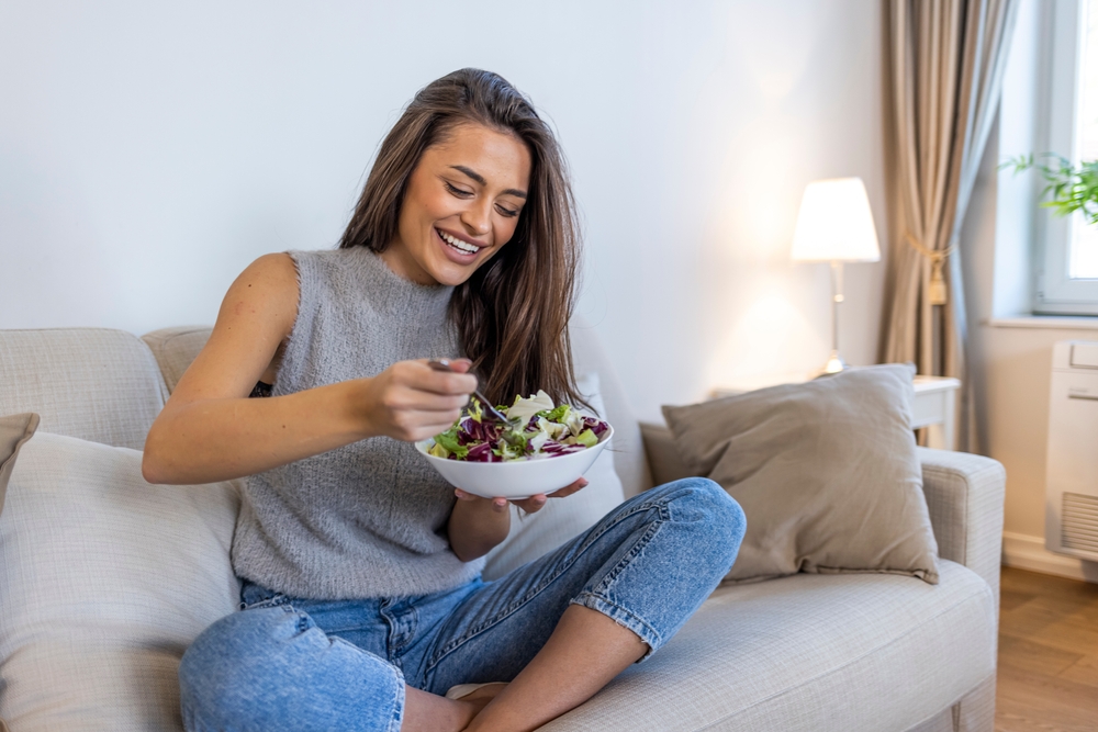 woman eating salad